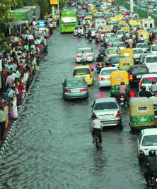 Sudden downpour causes waterlogging and jams in New Delhi on Friday.