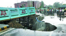The road near the Press Club of India caves in. 