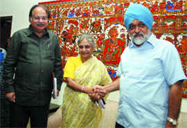 Sheila Dikshit, urban development and finance minister A.K. Walia and deputy chairman of Planning Commission Momtek Singh Ahluwalia in New Delhi on Friday.