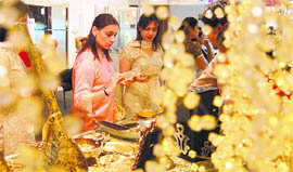 Women have a look at the decorative items on the inaugural day of Wedding Asia 09 exhibition in Ludhiana on Friday. 