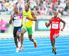 Usain Bolt (centre) with Daniel Bailey (right) of Antigua and Barbuda and Britains Simeon Williamson