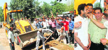 A divider being removed from in front of Panjab Univresitys Gate No. 3; and right Vice-Chancellor RC Sobti offers sweets to students who were on indefinite fast in Chandigarh on Saturday.