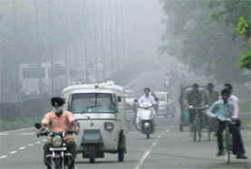Commuters make their way through the fog in Chandigarh on Saturday morning.