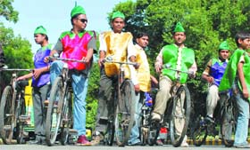 Cyclists take out a rally as part of campaign against Genetically Modified (GM) foods at Lodhi Garden in New Delhi