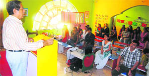   Dr DK Juneja delivers a lecture on swine flu at Poly Kids pre-school in Dehradun on Saturday. 