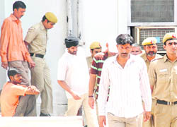 Presidents bodyguards, who were convicted in the Buddha Jayanti Park gangrape case, being taken out from the court by cops in New Delhi on Saturday.