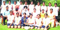 Players of the under-17 and under-19 football teams pose with trophy