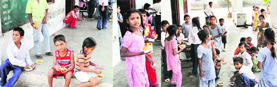 Students of Government Primary School relish langar as the midday meal ration was out of stock in the school at Jagraon