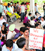 Patients face hardship as junior doctors continued strike outside the OPD of GND Hospital in Amritsar on Saturday.