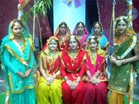 College girls enjoying the flower-bedecked swing during the Teej celebrations at DAV College for Women at Ferozepur.