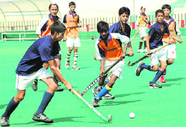 A match in progress between Gopal Hockey Academy, Kurali, and Shivalik Academy, Mohali, at Sector 42 stadium on Sunday. 