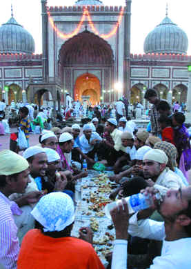 Muslims break their day-long fast at Jama Masjid.