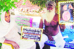 Harbans Singh Brahampuri and his wife at their house in Brahampur village near Ahmedgarh on Sunday. 