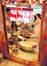 Women take a look at decoration items on the concluding day of Wedding Asia 09 exhibition in Ludhiana on Sunday.