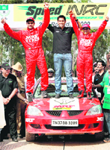 India captain M S Dhoni with the winners during a car rally in Bangalore on Sunday.