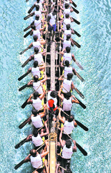 Participants during the Chambakkara boat race in Kochi on Sunday. 