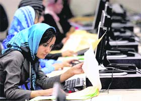 An election worker counts votes at the Independent Election Commission in Kabul