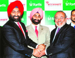 Fortis Healthcare and Religare Enterprises Group chairman Malvinder Mohan Singh (L), MD Shivinder M Singh and Wockhardt chairman Habib Khorakiwala in Mumbai on Monday. 