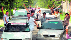 Members of the Hindustan Student Association take out a rally in Panjab University in Chandigarh on Monday.