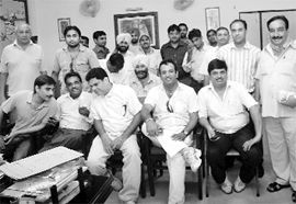 Contractors participate in the auction for paid parking lot in Panchkula on Monday.