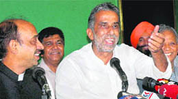 Haryana BJP president Kishan Pal Gurjar (centre) in a happy mood after party national general secretary Vijay Goyal (left) announced the break-up with the INLD in Chandigarh on Monday. On the extreme right is former Haryana party president Rattan Lal Kataria.