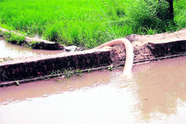 A pipe being used to draw water illegally from a canal in a Jhajjar village.