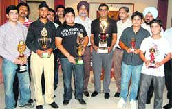 Winners of the Punjab Open Snooker Championship pose with their trophies in Ludhiana. 