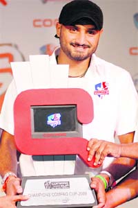Harbhajan Singh poses with the Compaq Cup in New Delhi