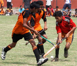 A hockey game at the Sports Stadium in progress during a district-level championship for high school students being organised in Bathinda on Tuesday.