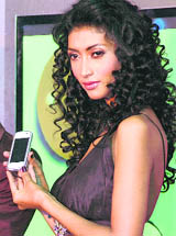 A model poses with a Nokia handset at its launch in New Delhi on Tuesday. The company launched two new models, Nokia 5530 and 5230 priced at Rs 13,994 and Rs 9995, respectively.