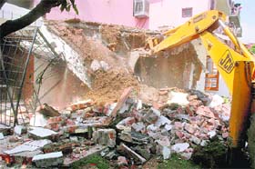 A JCB razes an illegal structure in Sector 44, Chandigarh
