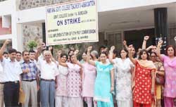 Teachers at Government College in Gurgaons Sector-14 on Tuesday stage a protest demanding the implementation of the Sixth Pay Commission