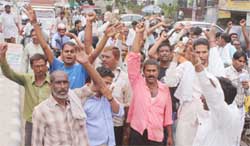 Employees of the Gurgaon Municipal Corporation demonstrate for their