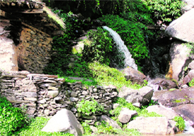 A stream of water on the slope of a hill.