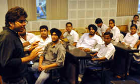 A speaker addresses students during a seminar at DAV College in Jalandhar.