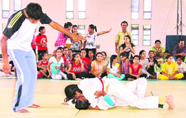 Participants at the District Inter-School Judo Championship being held at Guru Nanak Stadium in Ludhiana on Tuesday.