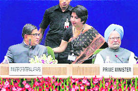 Prime Minister Manmohan Singh with Foreign Secretary Nirupama Rao (C) and External Affairs Minister SM Krishna at the Conference of Heads of Missions in New Delhi on Tuesday.
