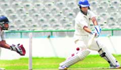 Sunny Sohal, a player of Punjab Blue team, plays a shot during a match at PCA Stadium in Mohali 