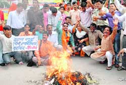 Shiv Sena activists burn Chinese goods at Clock Tower in Dehradun