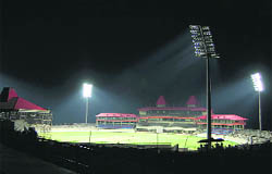 The Dharamsala cricket stadium with floodlights on.