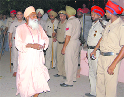 The dera head at the police station amid heavy police deployment in Ludhiana on Tuesday night.