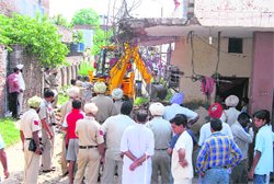 Encroachments being removed at Haibowal on Wednesday.
