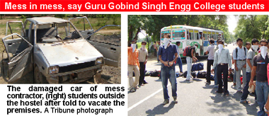 The damaged car of mess contractor, (right) students outside the hostel after told to vacate the premises. A Tribune photograph