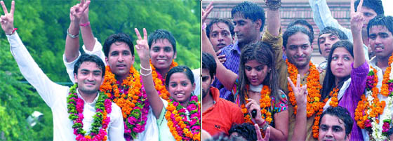Candidates of ABVP and NSUI (Right) celebrate after their nominations were confirmed for Delhi University Students Union elections in New Delhi on Thursday.