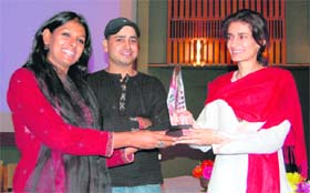 Actress and filmmaker Nandita Das gives away an award to CM Omar Abdullahs sister and Kashmiri poetess Safiya Abdullah in Srinagar