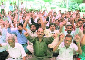 Members of the SC/ST Employees Union protest in support of their demands in Jammu