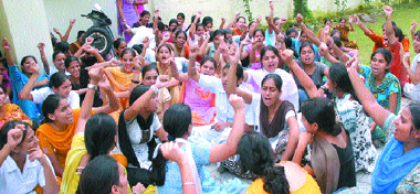 Students of Mahatma Hans Raj DAV Institute of Nursing raise slogans against the college principal.