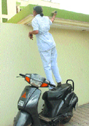 A daring student tries to scale a college wall.