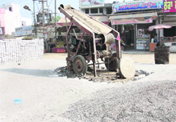 A sewage cleaning machine put up in the middle of the busy Raikot road at Jagraon. 