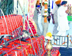Chief Minister Parkash Singh Badal pays obeisance at Gurdwara Bidhi Chand near Bhikhiwind in Tarn Taran on Thursday.
